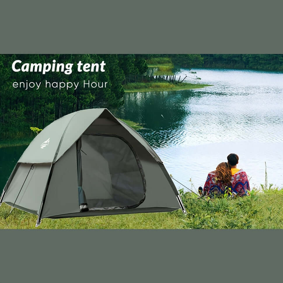 Dome camping tent by a lake with two people seated, showcasing an easy setup and spacious design for outdoor travel.