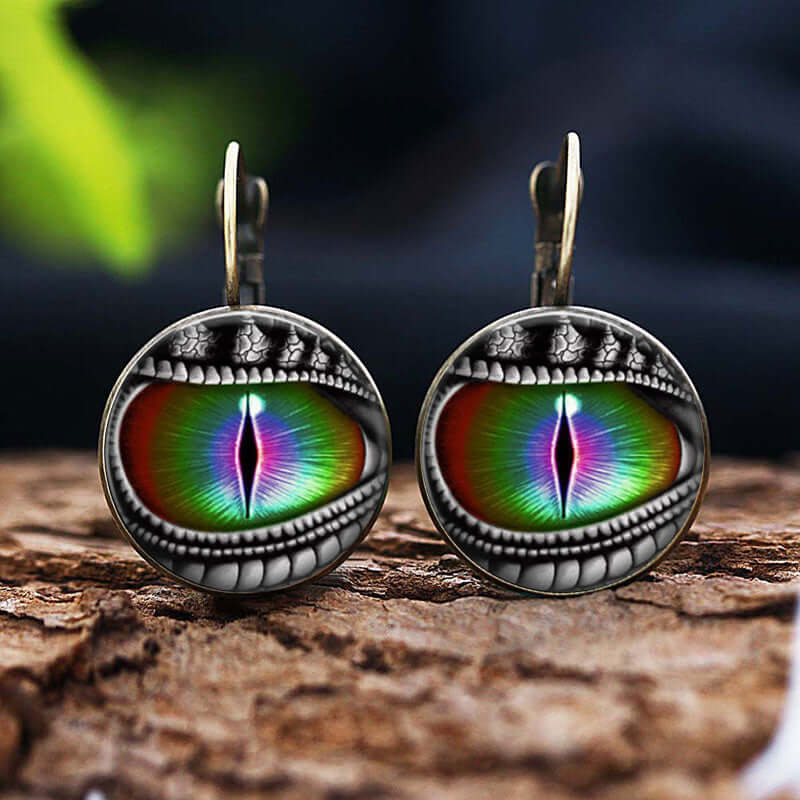 Y2K dragon eye gemstone earrings with vibrant colors, crafted in durable alloy, showcasing retro, bold design on rustic background.