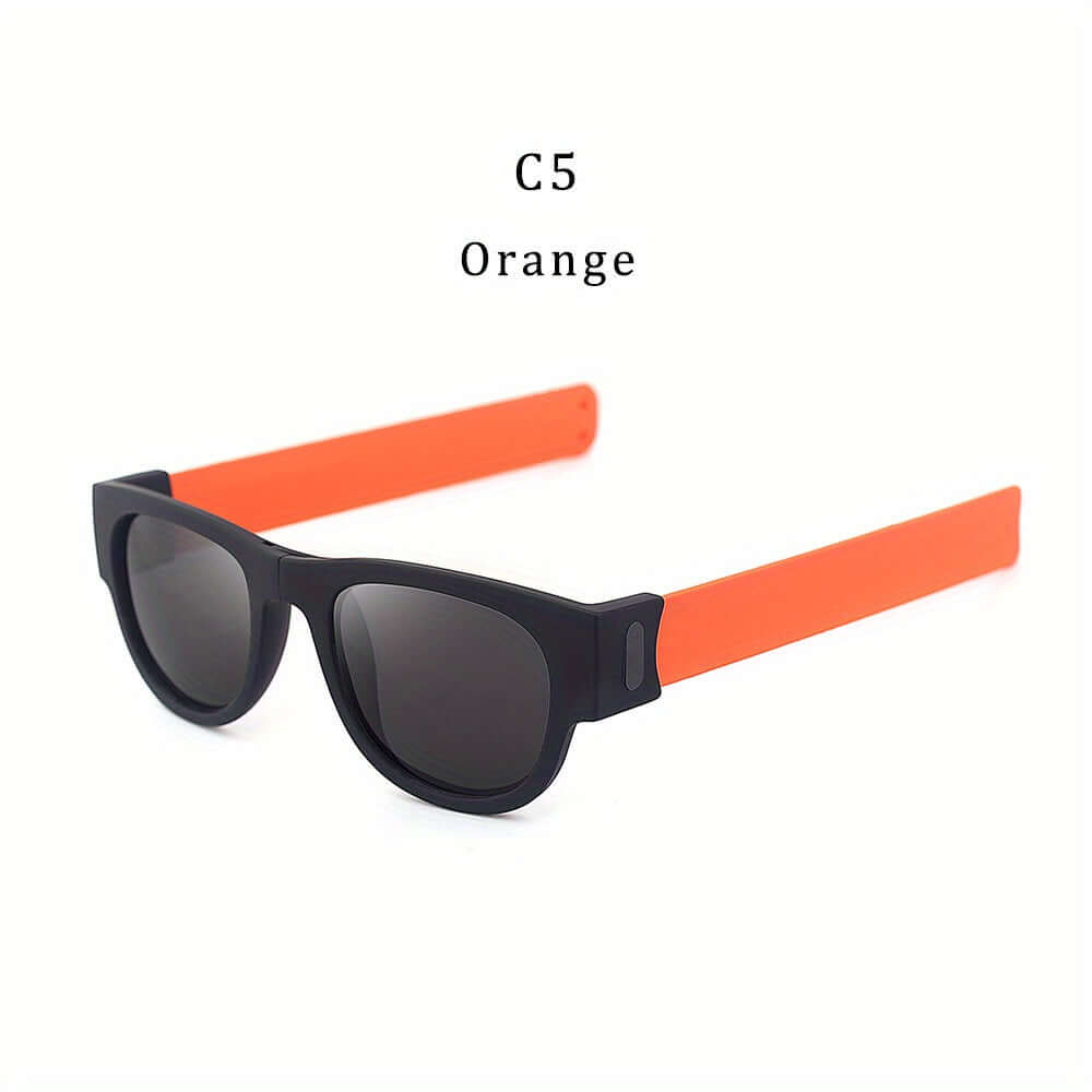 Foldable slap-on polarized sunglasses with orange arms and black frame, ideal for sporty outdoor activities and travel.