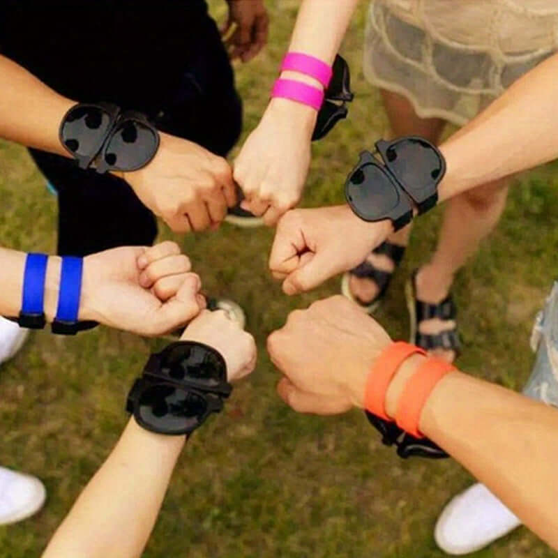 Group of people wearing colorful slap-on sunglasses on wrists outdoors