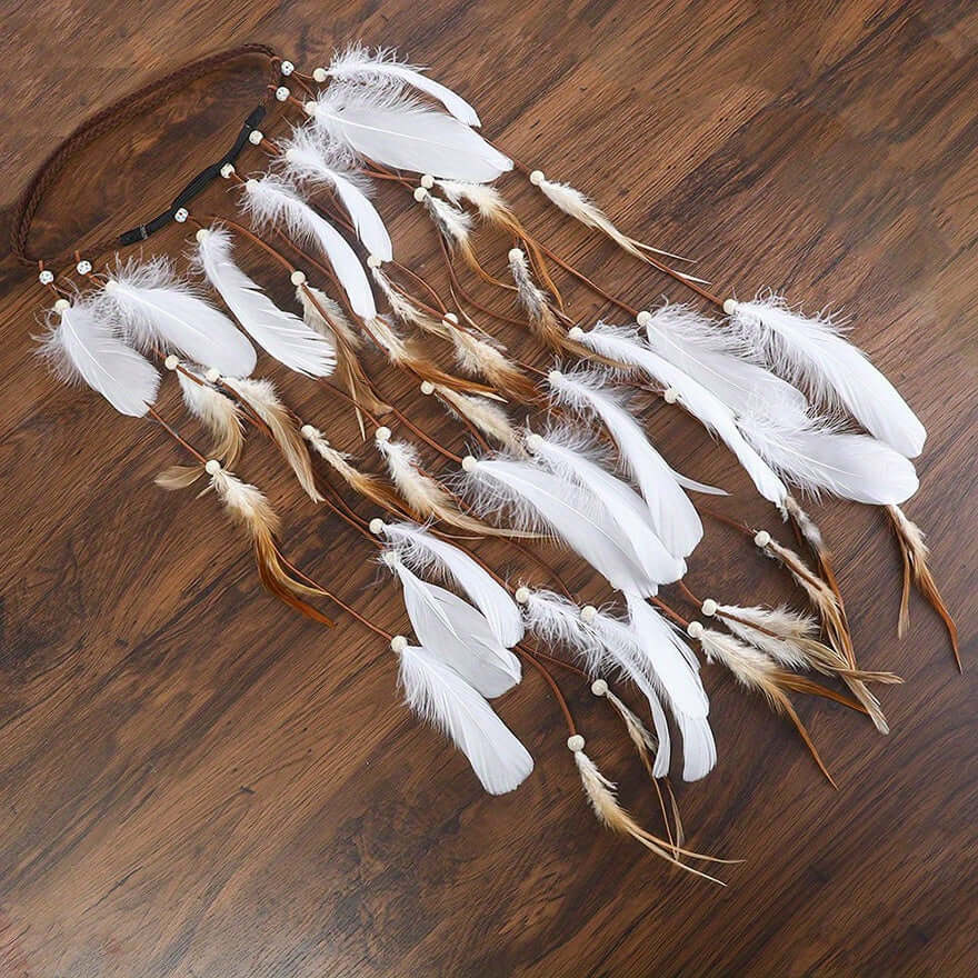 Boho faux feather tassel headband with white and brown feathers on a wooden surface, perfect for festival or casual bohemian outfits.