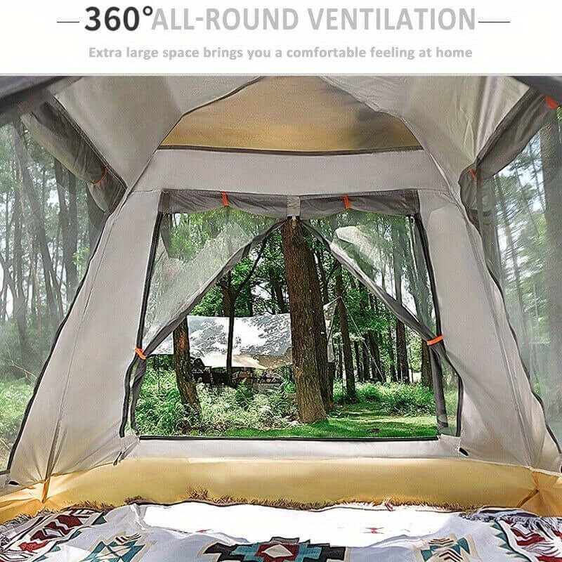 Interior view of a camping tent with 360-degree ventilation, showcasing a scenic forest through the window.