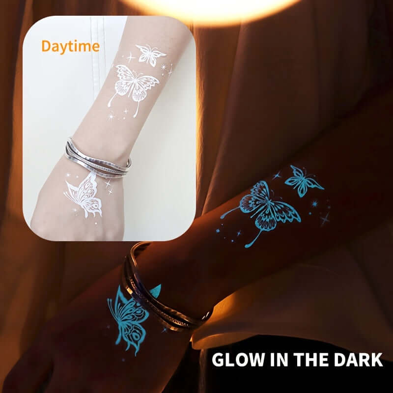 Glow-in-the-dark moon and star tattoos on wrist, featuring butterflies and flowers, perfect for festivals and parties.