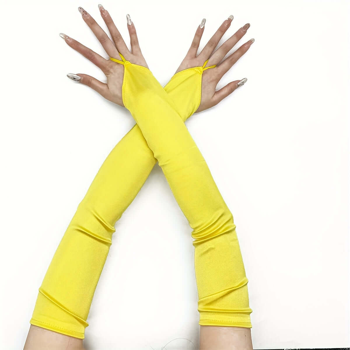 Yellow fingerless satin gloves crossed on white background, perfect for cosplay, rave, or evening parties.