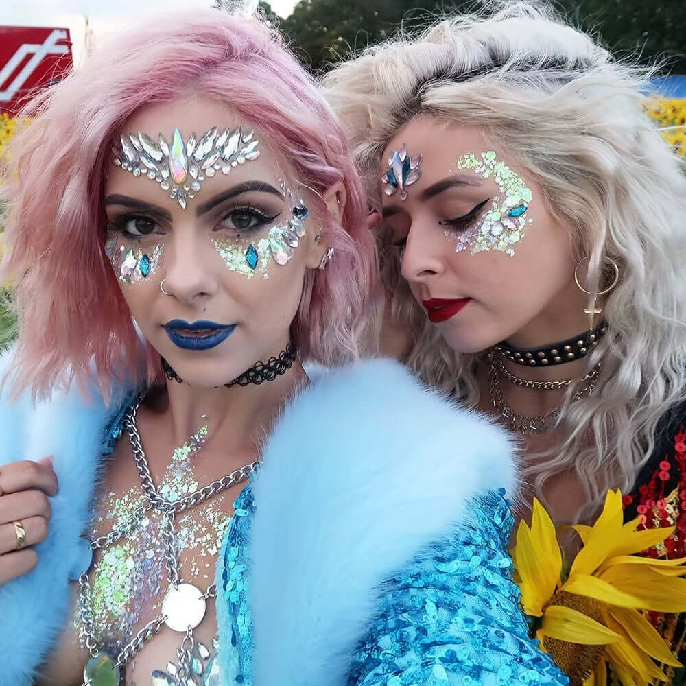 Women wearing 3D crystal tattoo face stickers with artificial diamond effect at a festival, showcasing dazzling party makeup.