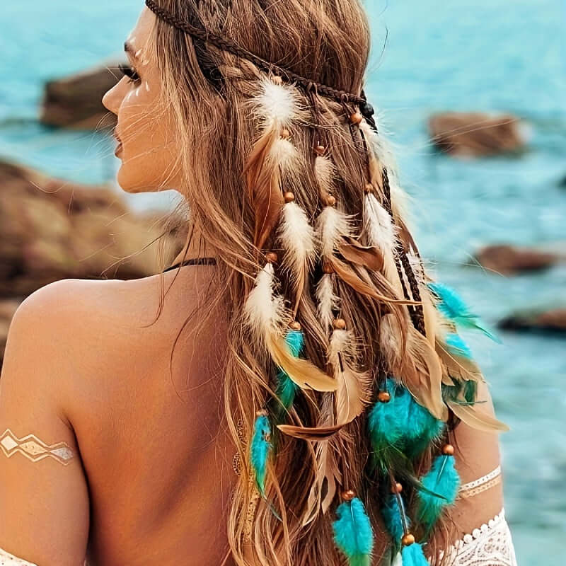 Woman wearing feather headband with boho style, featuring faux feathers and chicken feather accents, by the beach.