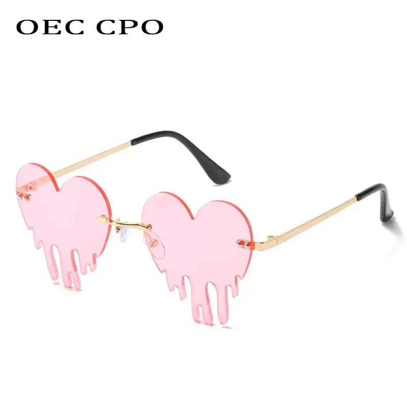 Heart-shaped rimless pink sunglasses with tear design, unique steampunk style, UV400 protection.