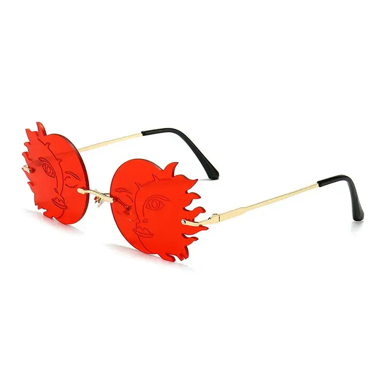 Red rimless irregular round sunglasses with sun face design and gold temples.