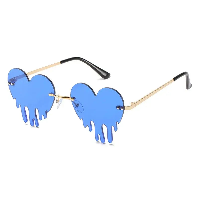 Blue heart-shaped rimless sunglasses with tear-shaped details and gold temples, featuring UV400 protection and unique steampunk style.