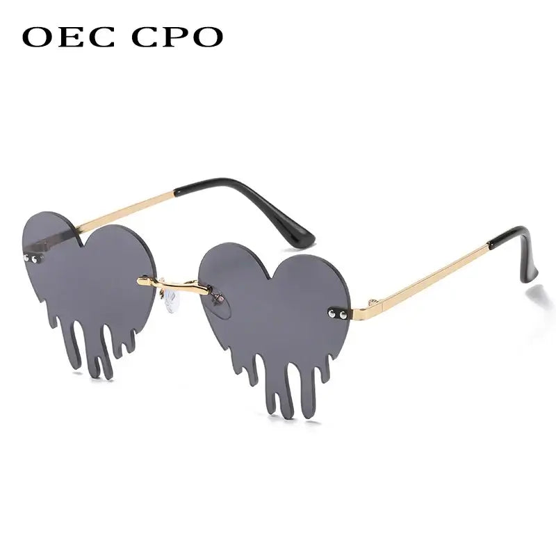 Rimless heart-shaped sunglasses with unique steampunk design and UV400 protection, featuring gradient polycarbonate lenses.