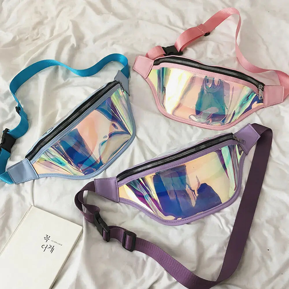 Holographic PVC fanny packs in three colors with adjustable straps, displayed on fabric, ideal for travel and raves.