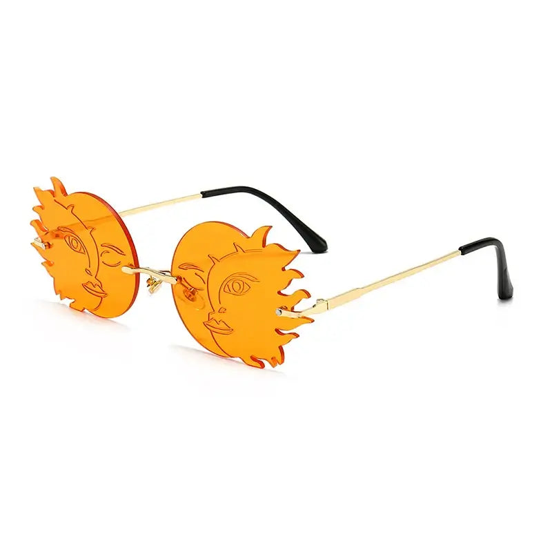 Bold rimless orange sunglasses with sun face design and UV400 lenses.