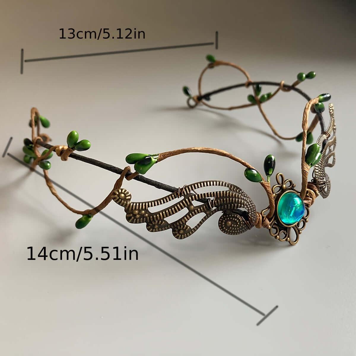 Handcrafted medieval witch headband with faux gemstones, vintage design, metal build, ideal for cosplay and festival wear.