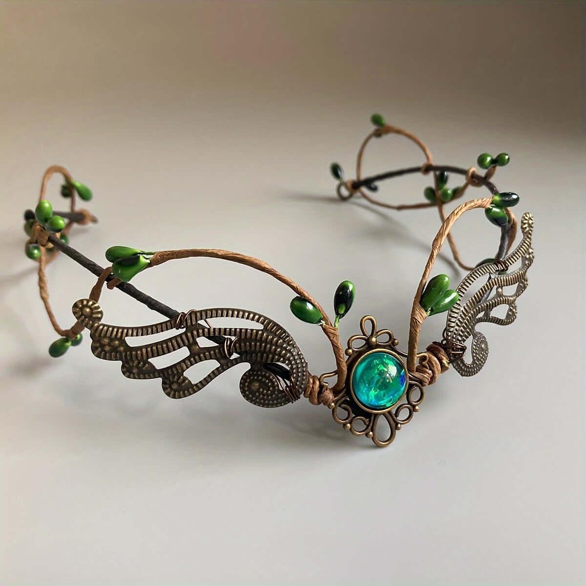 Handcrafted medieval witch headband with faux gemstones and elven design in metal for cosplay and electronic festivals.