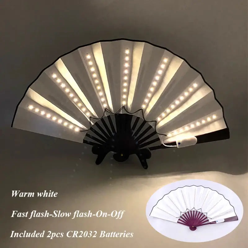 LED glow folding fan with warm white lights, featuring fast and slow flash settings, includes CR2032 batteries, ideal for performances.