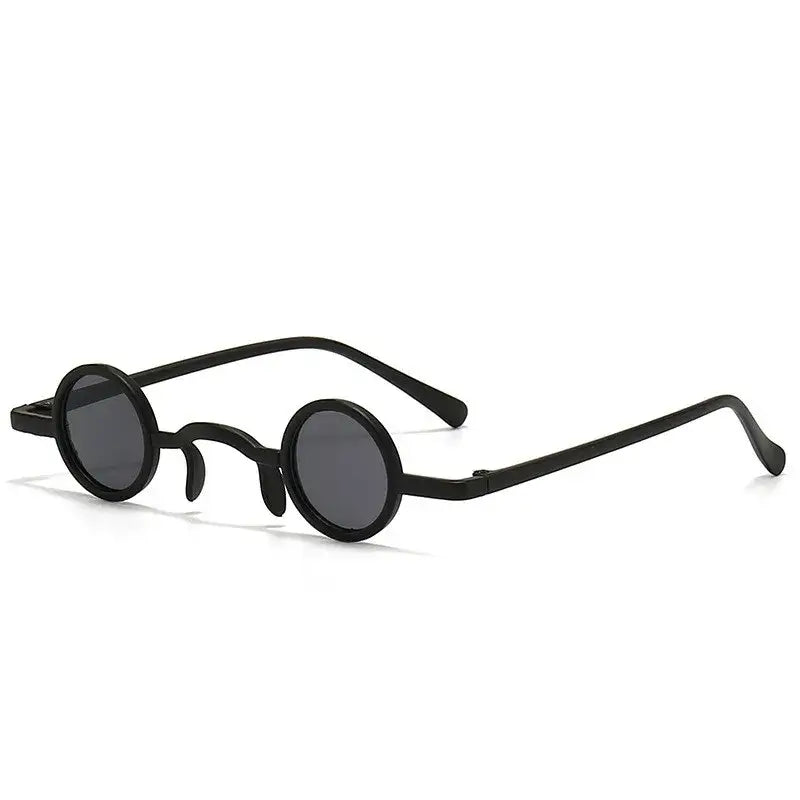 Classic vintage round sunglasses with small metal frame in black, perfect for a retro rock punk style for men and women.