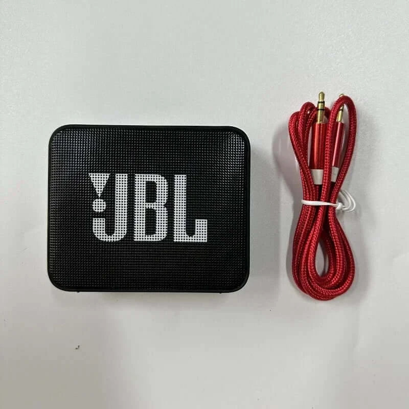 JBL GO 2 Bluetooth Speaker with red audio cable, compact design, wireless and waterproof, perfect for portable music playback.