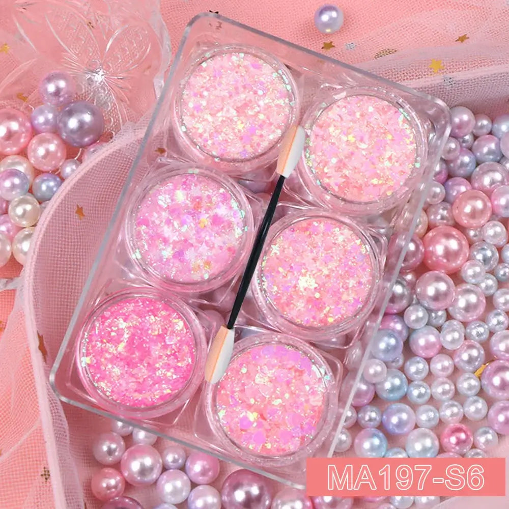 6 jars glitter gel set with pink, heart, star, and moon sequins for face, hair, and body makeup amid colorful pearls and mesh fabric.