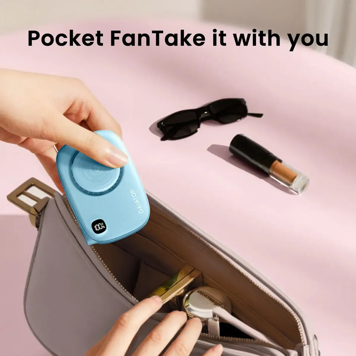 "Gaiatop Mini Fan with Makeup Mirror fits into a handbag, ideal portable accessory for travel and on-the-go makeup routines."