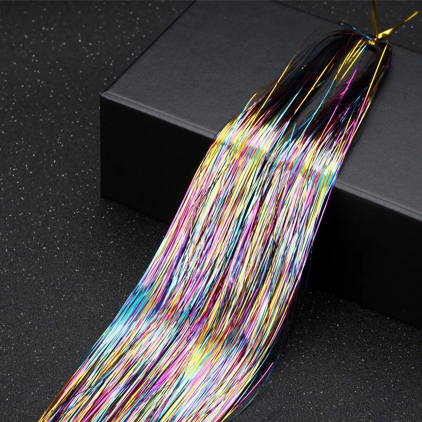 Rainbow glitter hair tinsel kit with 16 vibrant colors for party hairstyles, displayed on a black box.