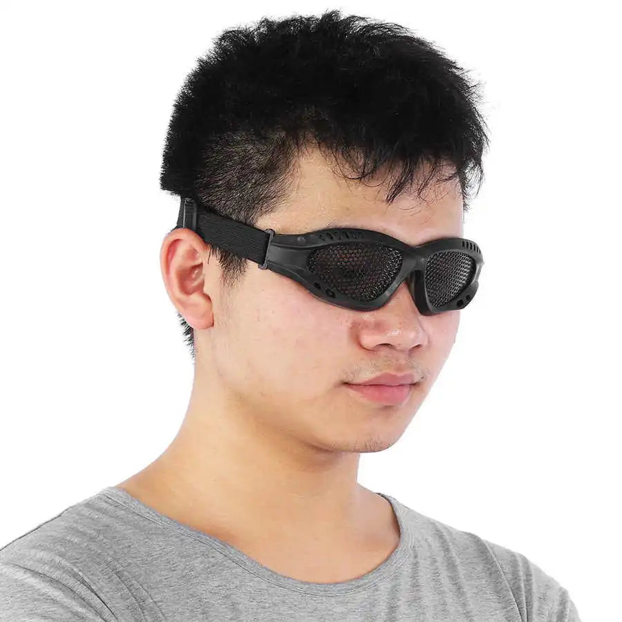 Person wearing metal mesh festival goggles for rave protection.