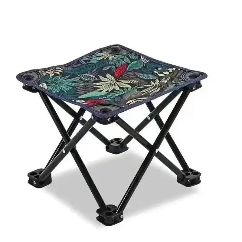 Compact folding stool with floral design, ideal for camping, fishing, and beach trips; lightweight and portable for easy transport.