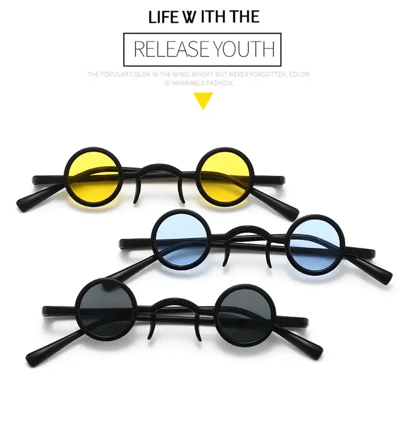 Round vintage sunglasses in yellow, blue, and black lenses with small metal frames, showcasing a classic punk rock style.