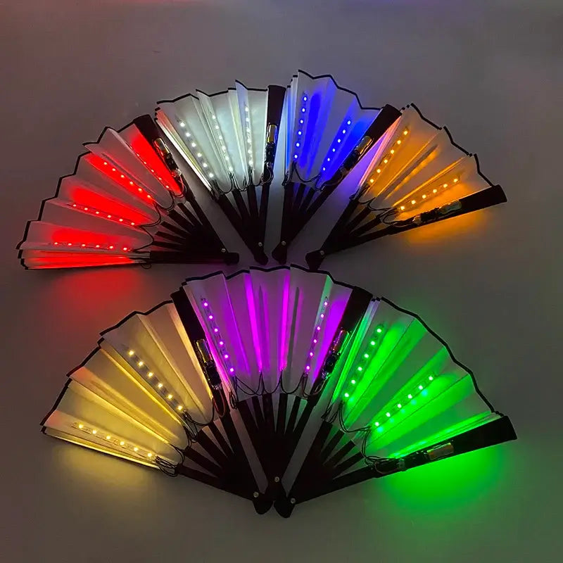 Colorful LED glow folding fans in 15 vibrant shades, perfect for dance and stage performances, shown in a dark setting.