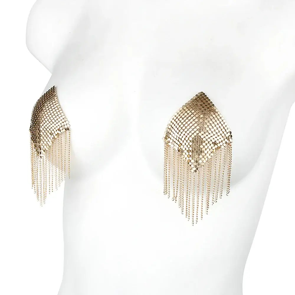 Gold metallic tassel nipple covers with chain edge design on mannequin, heart-shaped and self-adhesive for bold, glamorous styling.