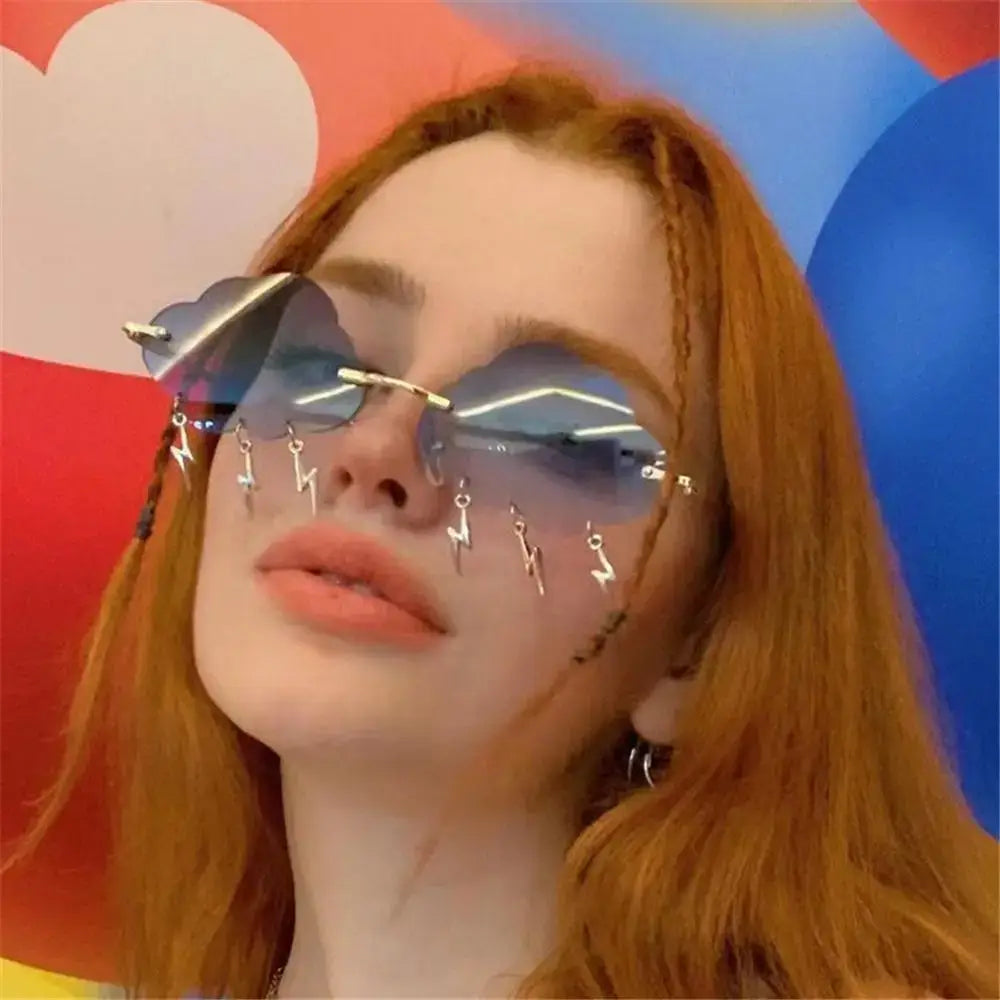 Woman wearing blue retro cloud lightning sunglasses with colorful background, showcasing 90s disco party style.