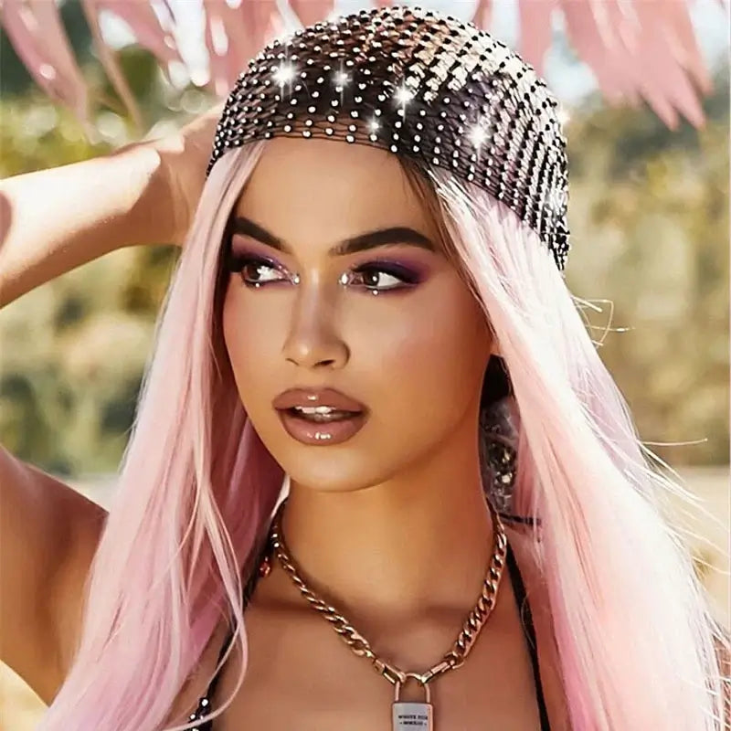 Woman wearing a crystal rhinestone fishnet headscarf with long pink hair, perfect for hip hop streetwear and festival fashion.