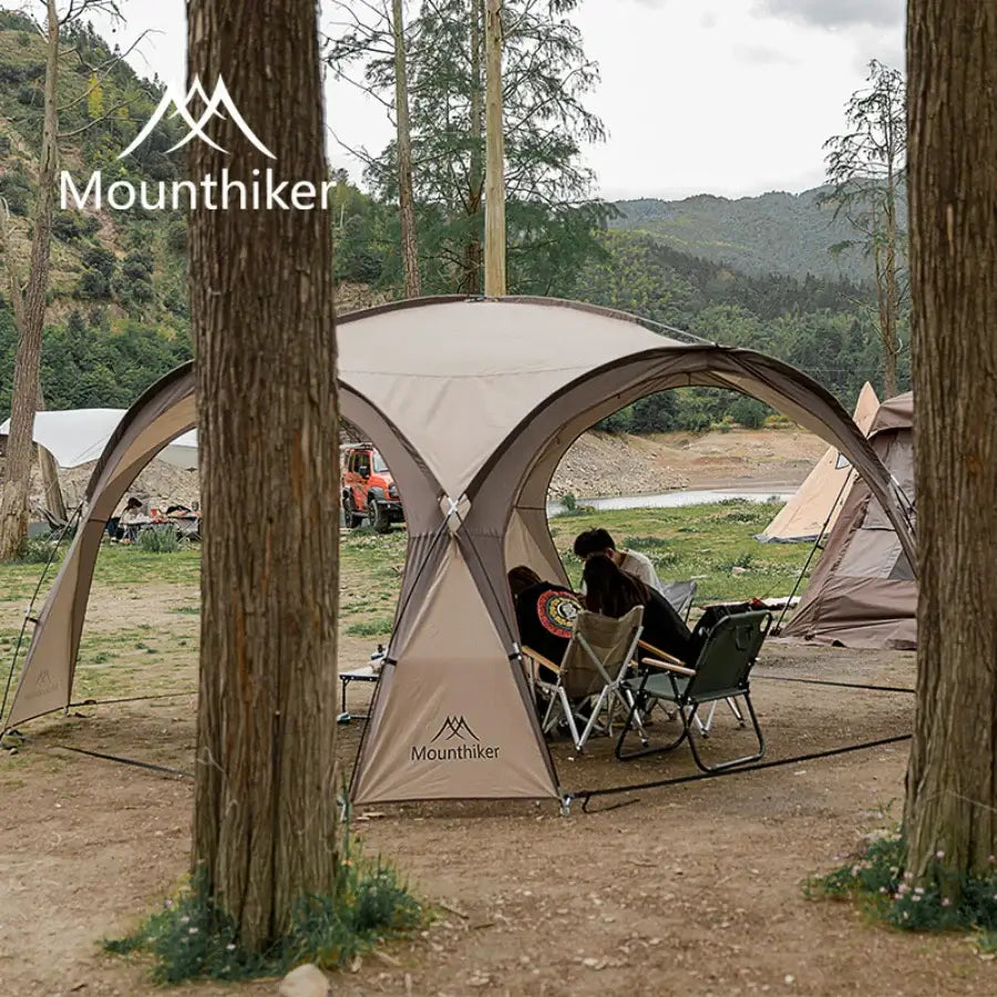 Dome tent pitched in a scenic forest setting, showcasing its portability and spacious design for outdoor camping adventures.