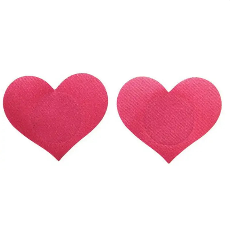 Heart-shaped pink disposable adhesive nipple covers for discreet and stylish coverage.