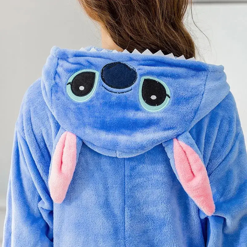 Blue Stitch cartoon onesie costume hood with pink ears, made of soft flannel for adults, perfect for cozy lounging or parties.