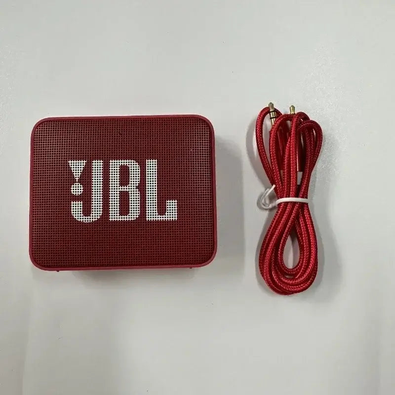 Red JBL GO 2 Bluetooth Speaker with charging cable, featuring wireless, waterproof design and super bass.