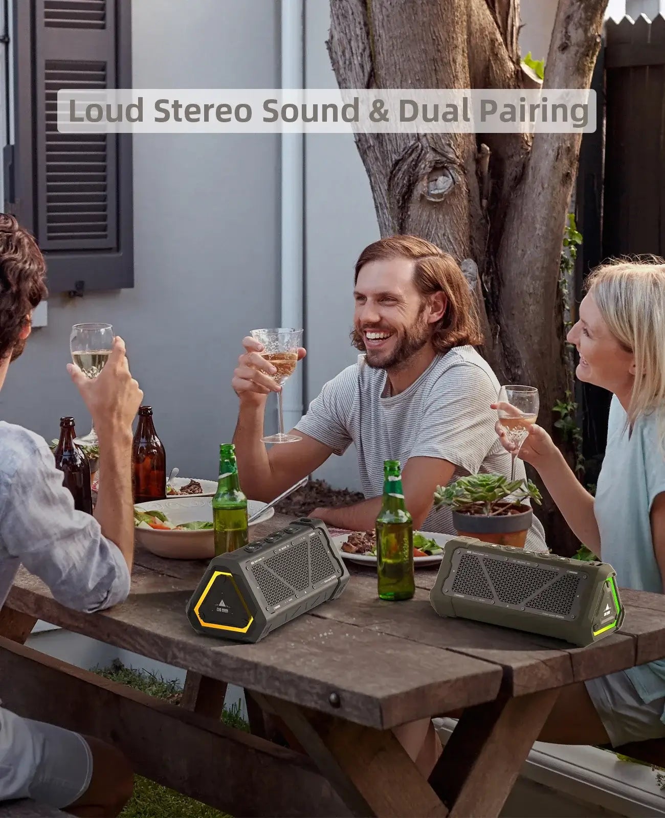 Friends enjoying a meal outdoors with MLOVE P3 Bluetooth speaker, highlighting loud stereo sound and dual pairing features.