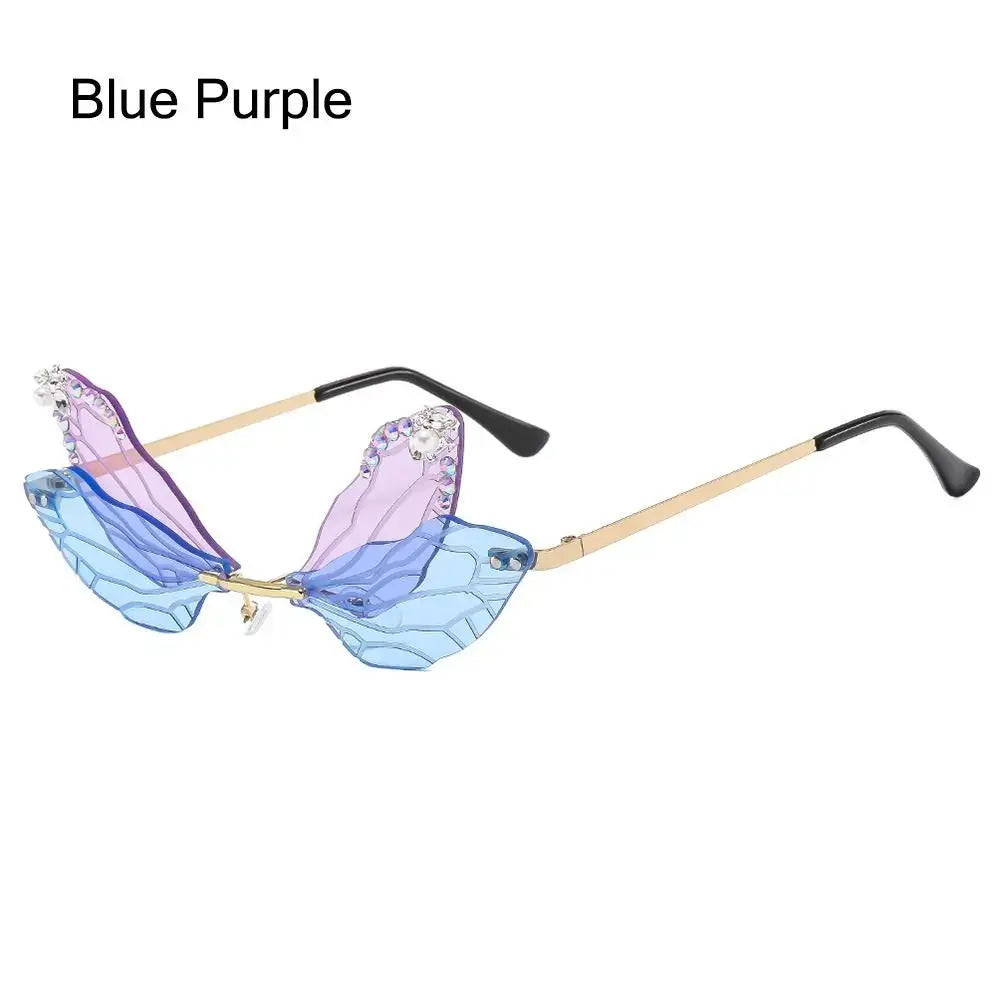 Blue purple dragonfly wing sunglasses with diamond embellishments and gold frame, luxury fashion accessory for parties.