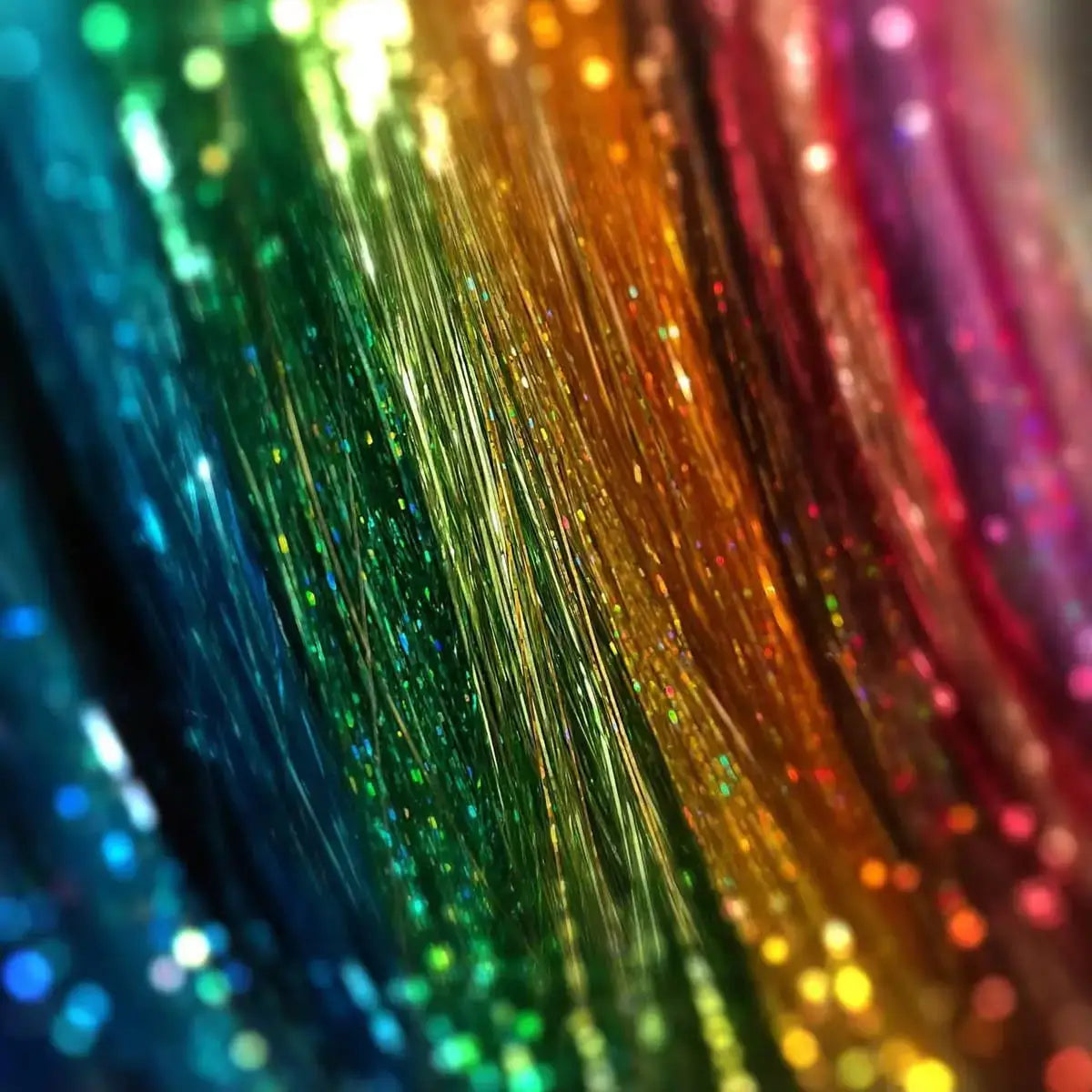 Vibrant rainbow glitter hair tinsel kit with 16 shimmering colors, perfect for parties and festivals.