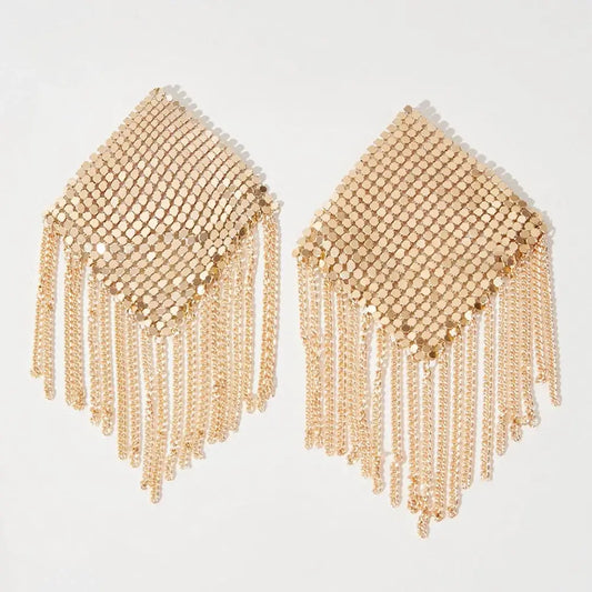 Gold metallic tassel nipple covers with diamond shape and chain design on white background