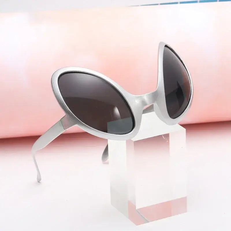 Alien Party Sunglasses with unique design, perfect for festivals, ergonomic and eco-friendly material ensures comfort and safety.