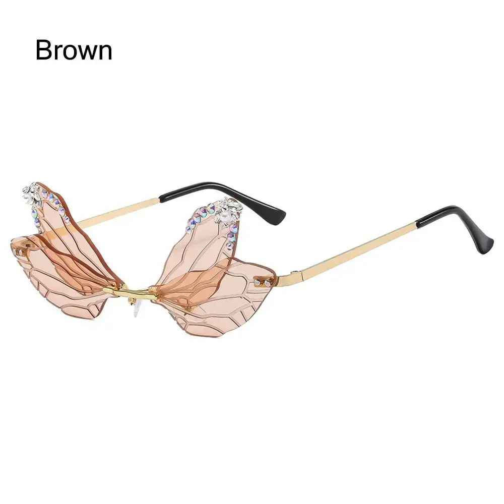 Brown dragonfly wing sunglasses with diamond embellishments and irregular frames for luxury fashion parties.