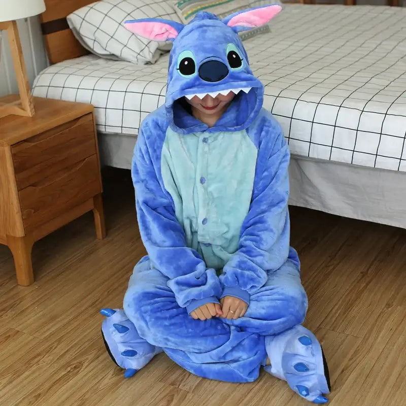 Cozy Stitch cartoon onesie costume for adults with hood and paws, perfect for lounging or costume parties.