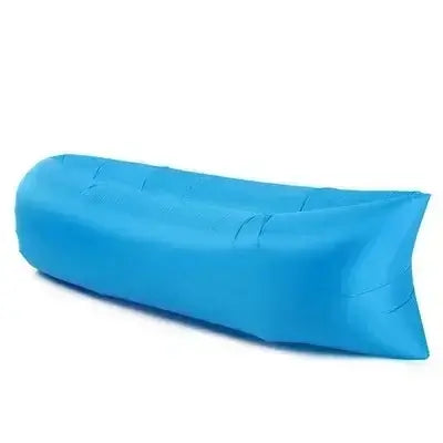 Portable blue inflatable air lounger sofa for outdoor use, ideal for camping, beach, and backyard lounging.