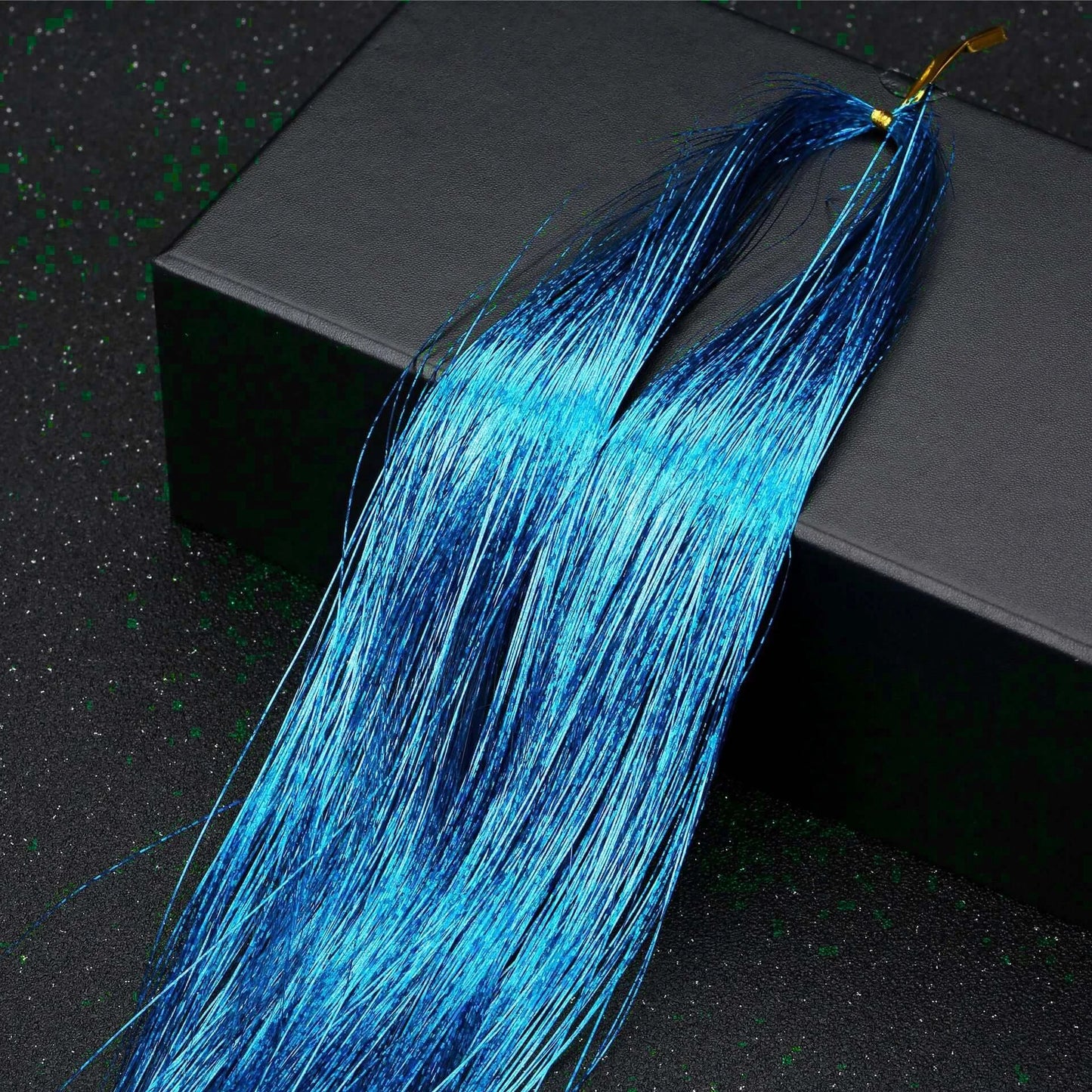 Blue glitter hair tinsel extensions from the Rainbow Glitter Hair Tinsel Kit, perfect for party and festival hairstyles.