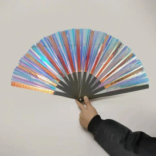 Large transparent rave hand fan with shining effects and vibrant colors, held by a hand; perfect for festivals and home decoration.