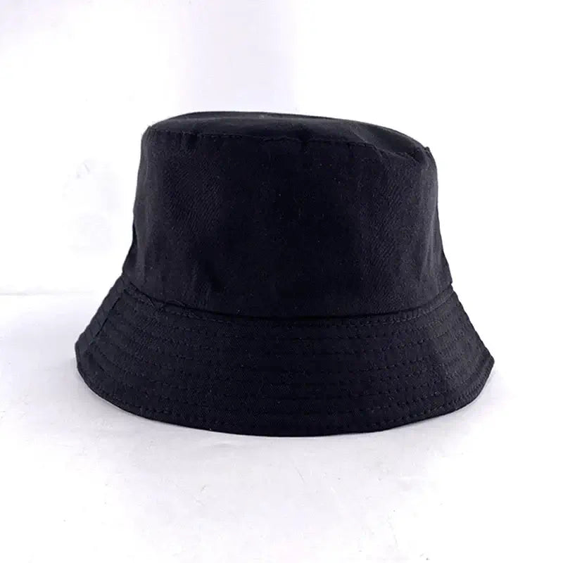 Plain black bucket hat with a simple design, suitable for fashion and outdoor activities.