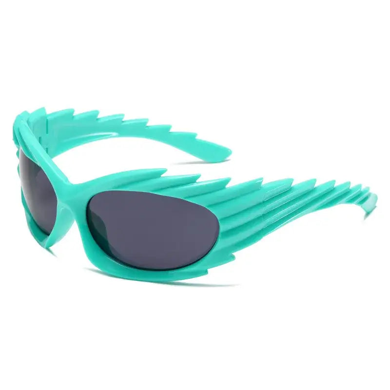 Y2K punk one-piece rave sunglasses in teal with rimless, futuristic design for men and women.