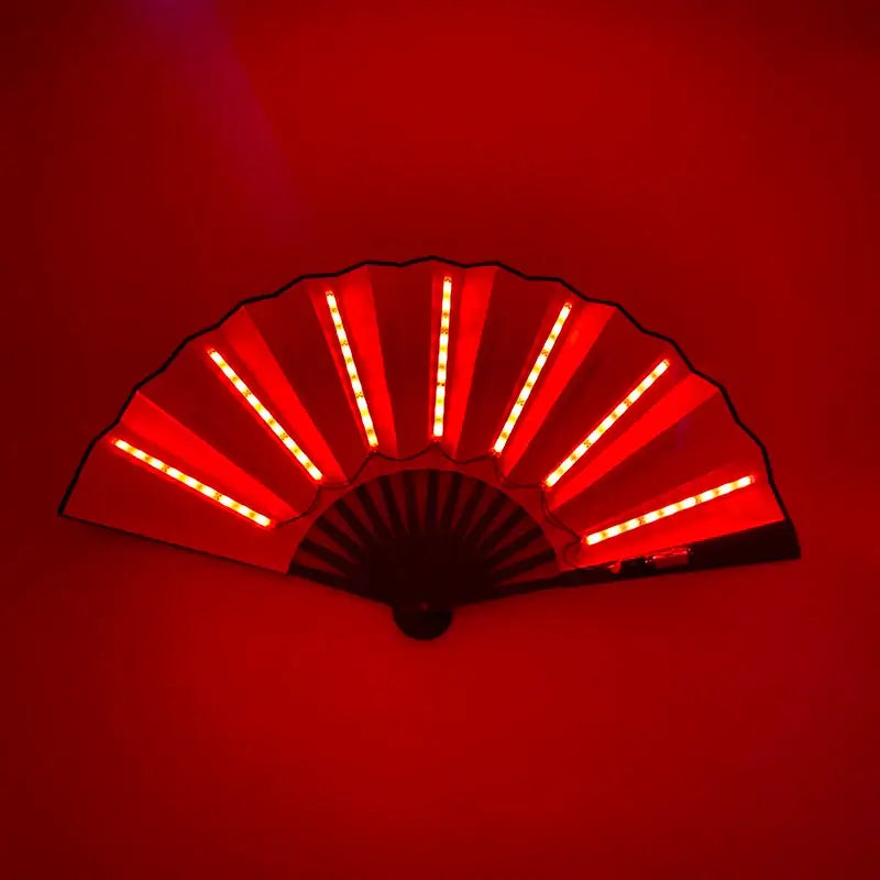 Red LED glow folding fan illuminated against a dark background, perfect for dance performances and rave parties.