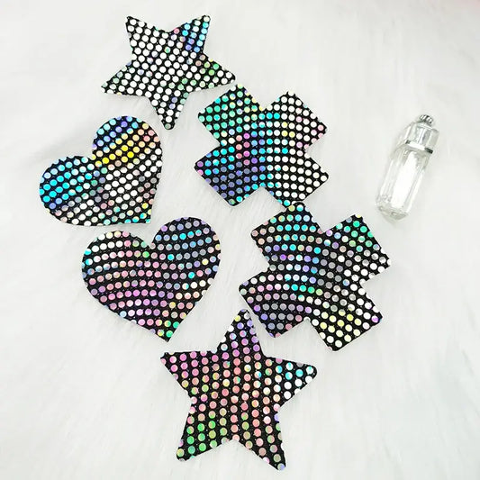 Ultra-thin laser sequin nipple covers in star, heart, and cross shapes on a white background.