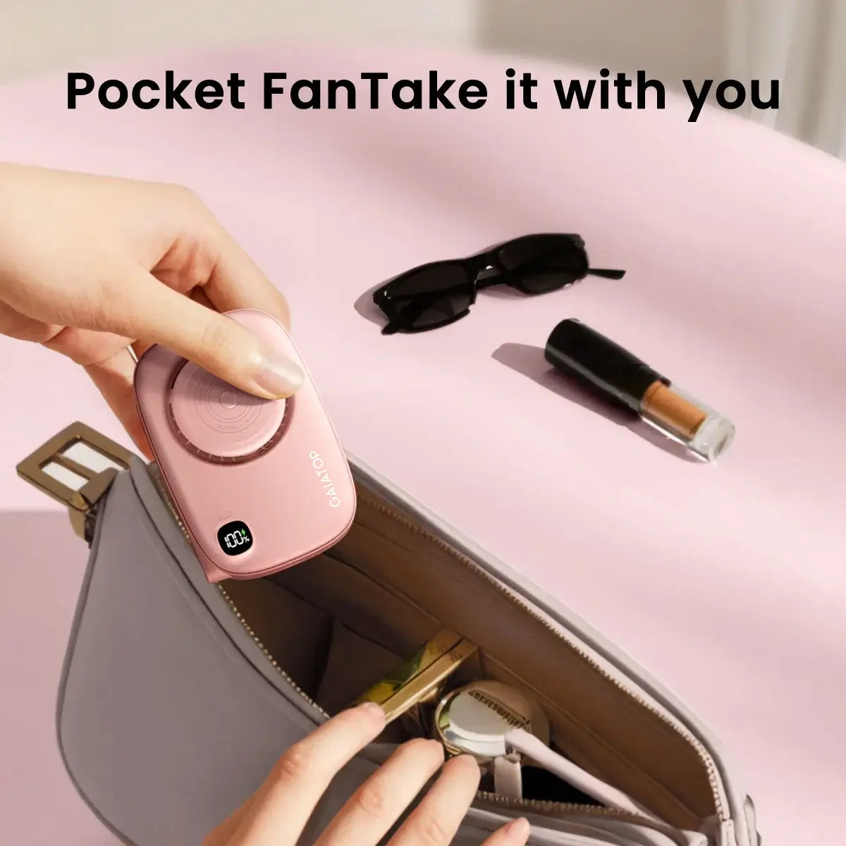 Gaiatop Mini Fan with Makeup Mirror being placed in a purse, featuring compact design, USB rechargeable, ideal for travel and touch-ups.